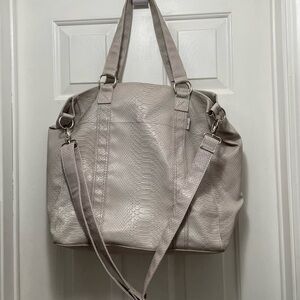Cream Travel Bag with Structured Design and Adjustable Strap
